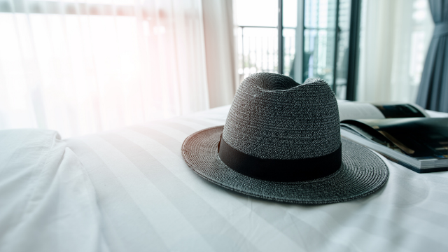 Italian superstitions hat on a bed